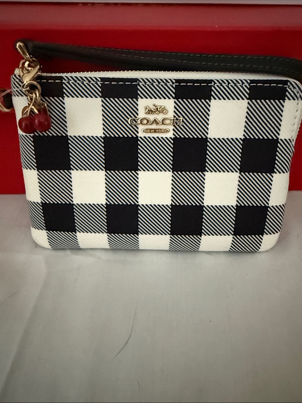 Coach Black and White Check Wristlet with Cherry Charm
